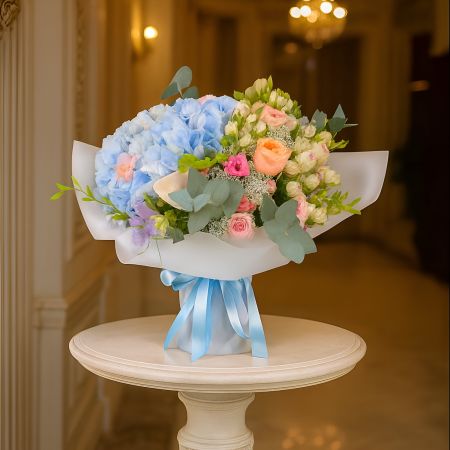 hydrangea, calla (3 pcs.), spray roses (3 pcs.), trachelium, freesia (3 pcs.), vuvuzela rose, packaging, ribbon