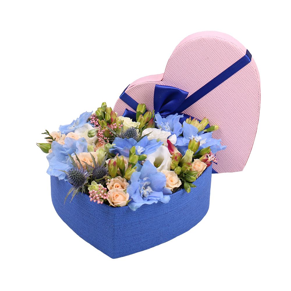 delphinium, oasis, spray rose (2 pcs.), eryngium, freesia (3 pcs.), eustoma (2 pcs.), heart-shaped box, packaging, ribbon